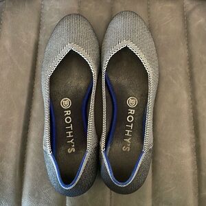 Grey toned Rothy’s with blue trim.